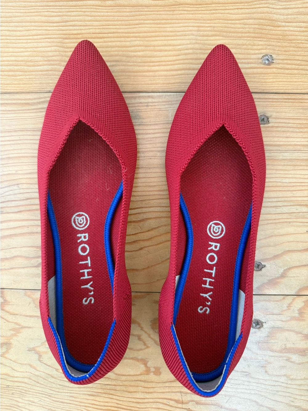 Red classic point Rothy’s flats size 9.5